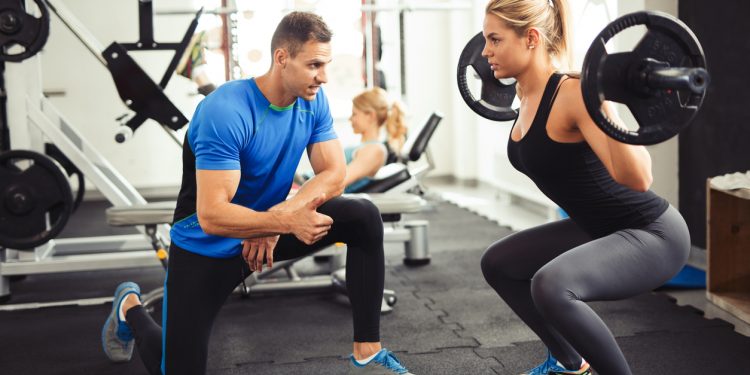 training in the gym with a personal trainer